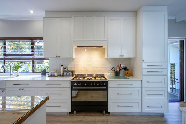 White built-in kitchen cupboards